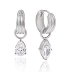 Waterproof gold huggie earrings with large brilliant-cut teardrop stones for swimming.