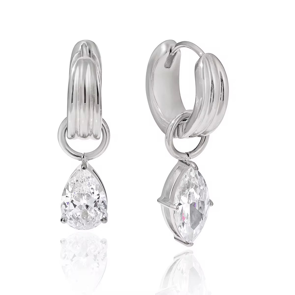Waterproof gold huggie earrings with large brilliant-cut teardrop stones for swimming.