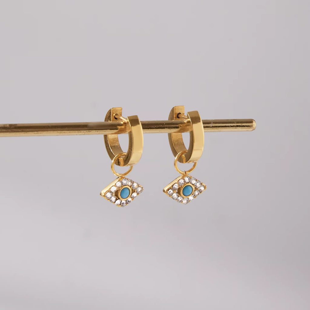 Technical drawing of earrings showing 0.97cm hoop and 1.32cm diamond-shaped charm.