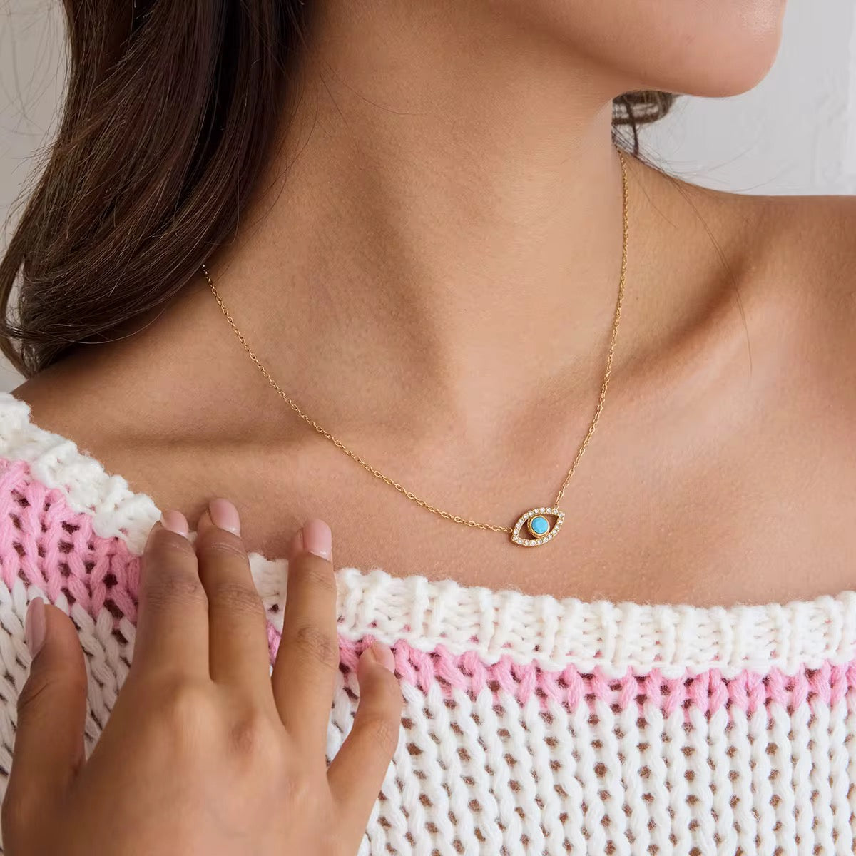 Guardian of the Blue Soul necklace featuring a turquoise evil eye and 18k gold PVD plating.