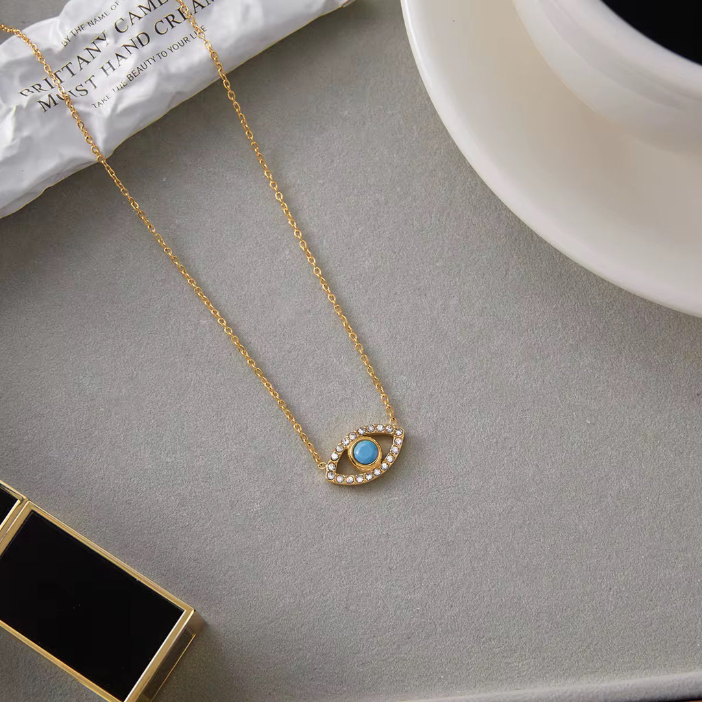 Non-tarnish 18k gold plated Guardian of the Blue Soul necklace with a 1-year warranty.