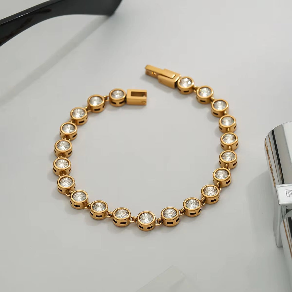 Waterproof bezel-set crystal bracelet for swimming and active lifestyles.