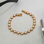 Waterproof bezel-set crystal bracelet for swimming and active lifestyles.