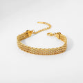 Detail of the secure 18k gold PVD plated lobster clasp on a watch belt chain.