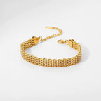 Detail of the secure 18k gold PVD plated lobster clasp on a watch belt chain.