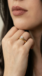 Waterproof gold asymmetrical statement ring with a brilliant-cut teardrop solitaire.