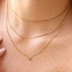 Waterproof gold triple chain necklace with bead and snake chain details for swimming.