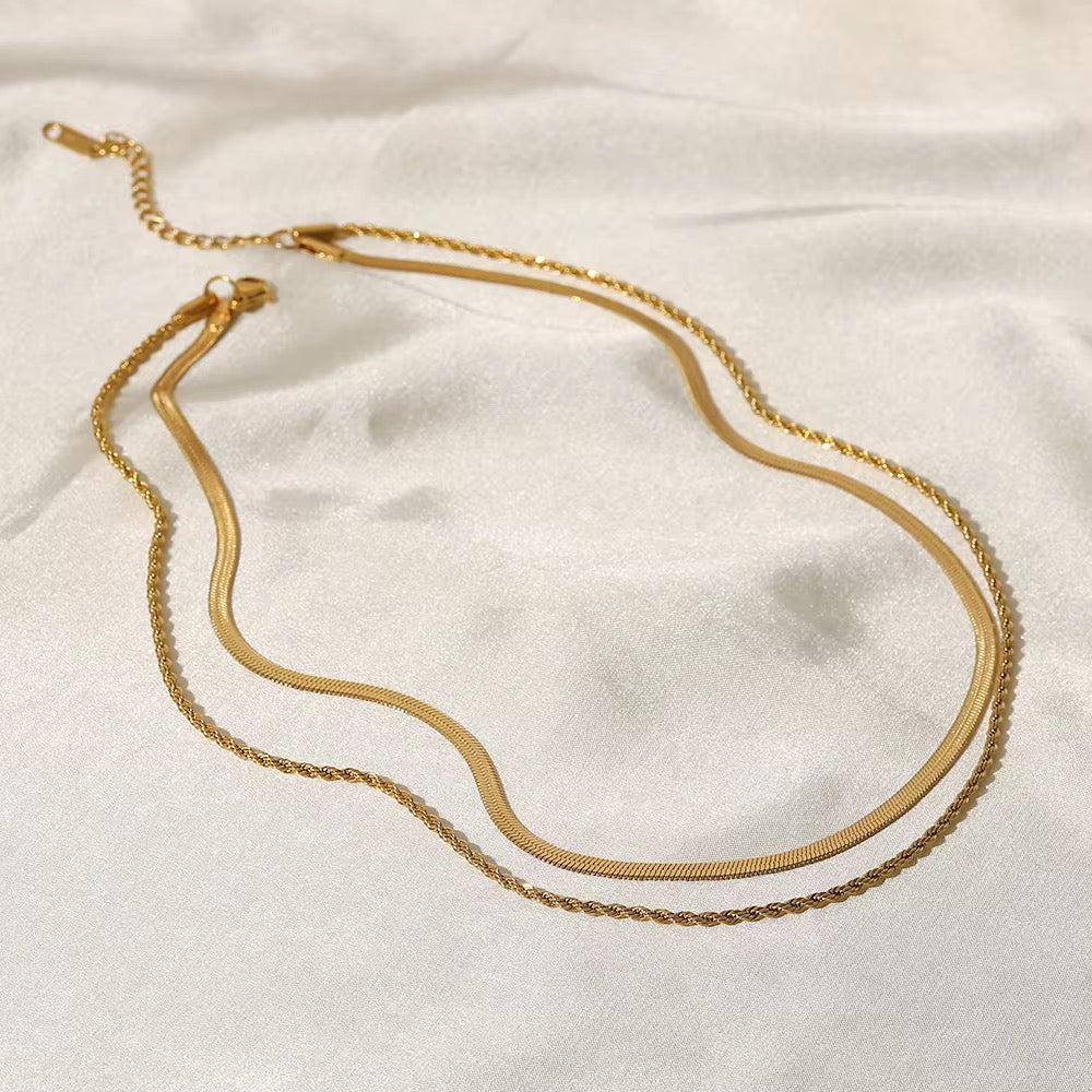 Duo Harmony layered necklace featuring 18k gold PVD plated herringbone and rope chains.