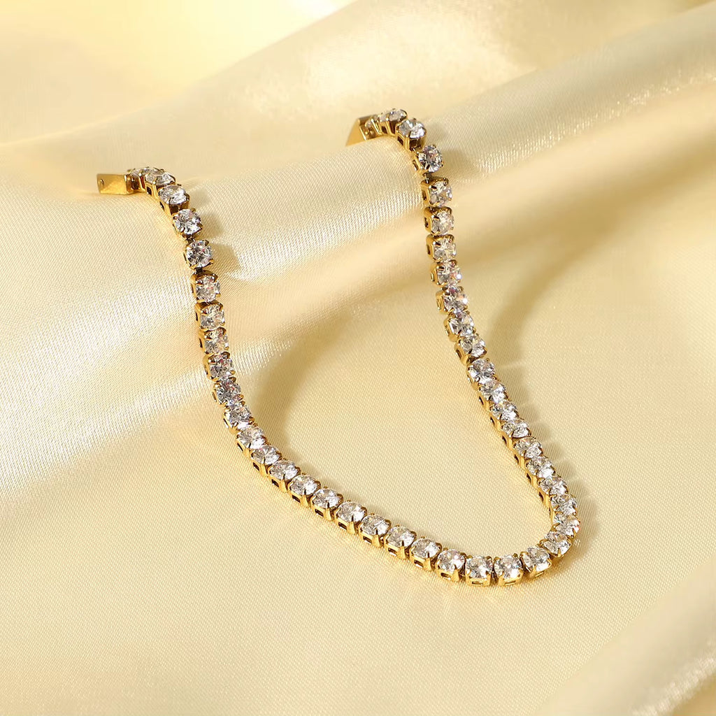 Waterproof gold tennis bracelet with 3.03mm brilliant-cut stones for swimming and active wear.