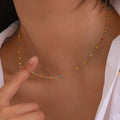 Confetti Tide choker necklace featuring 18k gold PVD plated stainless steel and colorful beads.