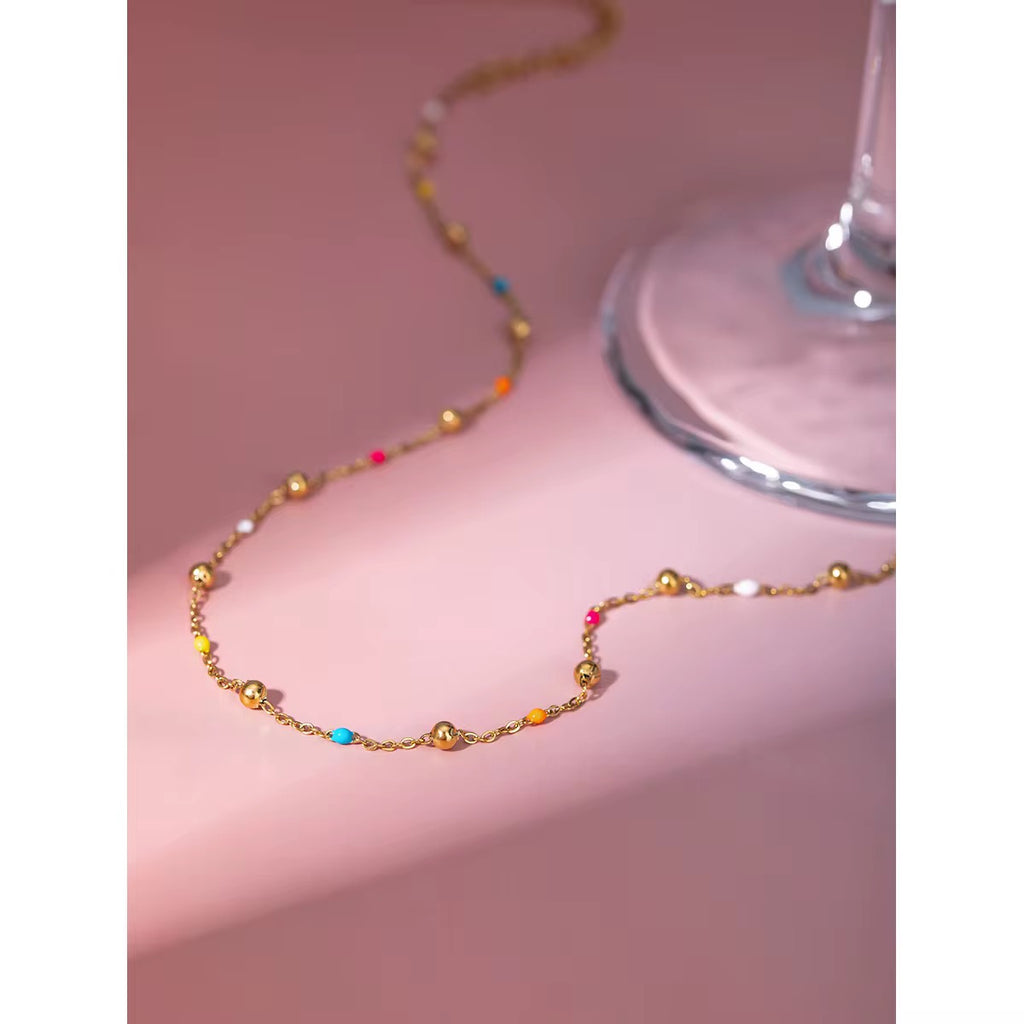 Technical drawing of the choker showing 40cm base length, 6cm extender, and 2.3g weight.