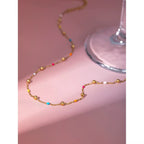 Technical drawing of the choker showing 40cm base length, 6cm extender, and 2.3g weight.