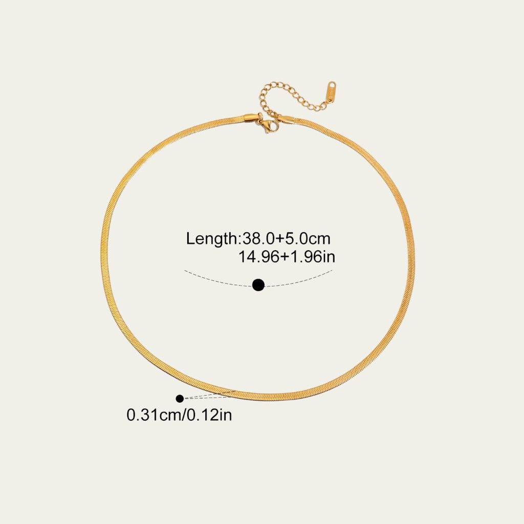 Detail of the secure gold lobster clasp and 5cm extender chain on a herringbone necklace.