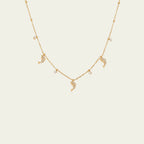 Waterproof gold dolphin charm necklace for swimming and active daily lifestyles.