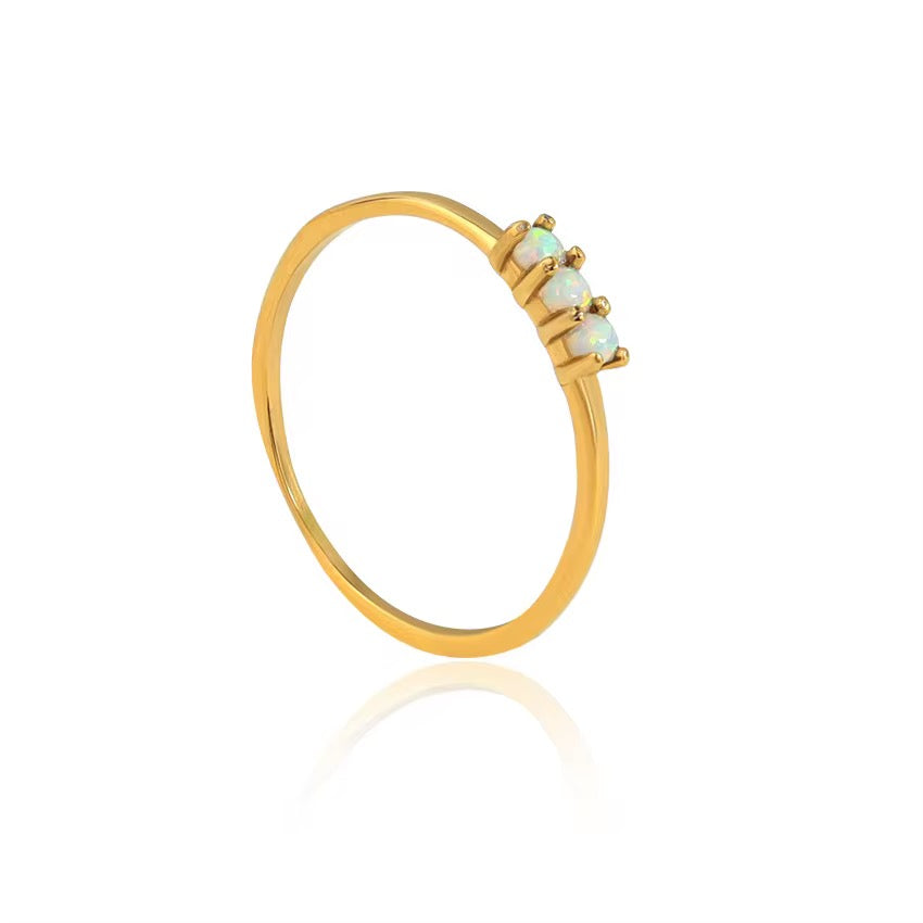Tarnish-free 316L stainless steel ring showing three-stone opal design with high-shine polished finish.