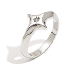 Ocean-proof gold starburst ring next to silver variant highlighting modern dome shape.