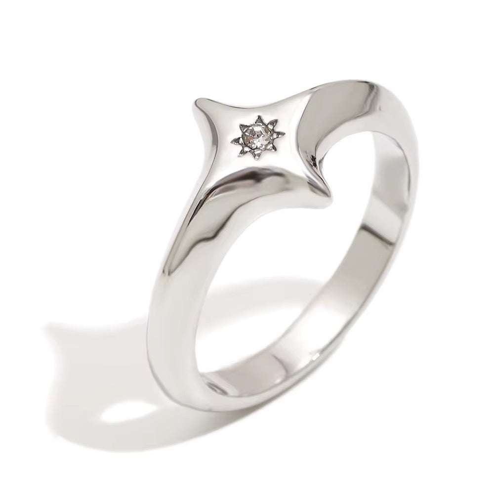 Ocean-proof gold starburst ring next to silver variant highlighting modern dome shape.