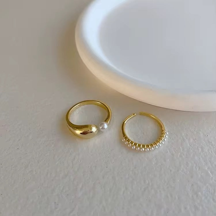 Sweat-proof 18k gold plated adjustable ring set featuring smooth gold and pave pearls.