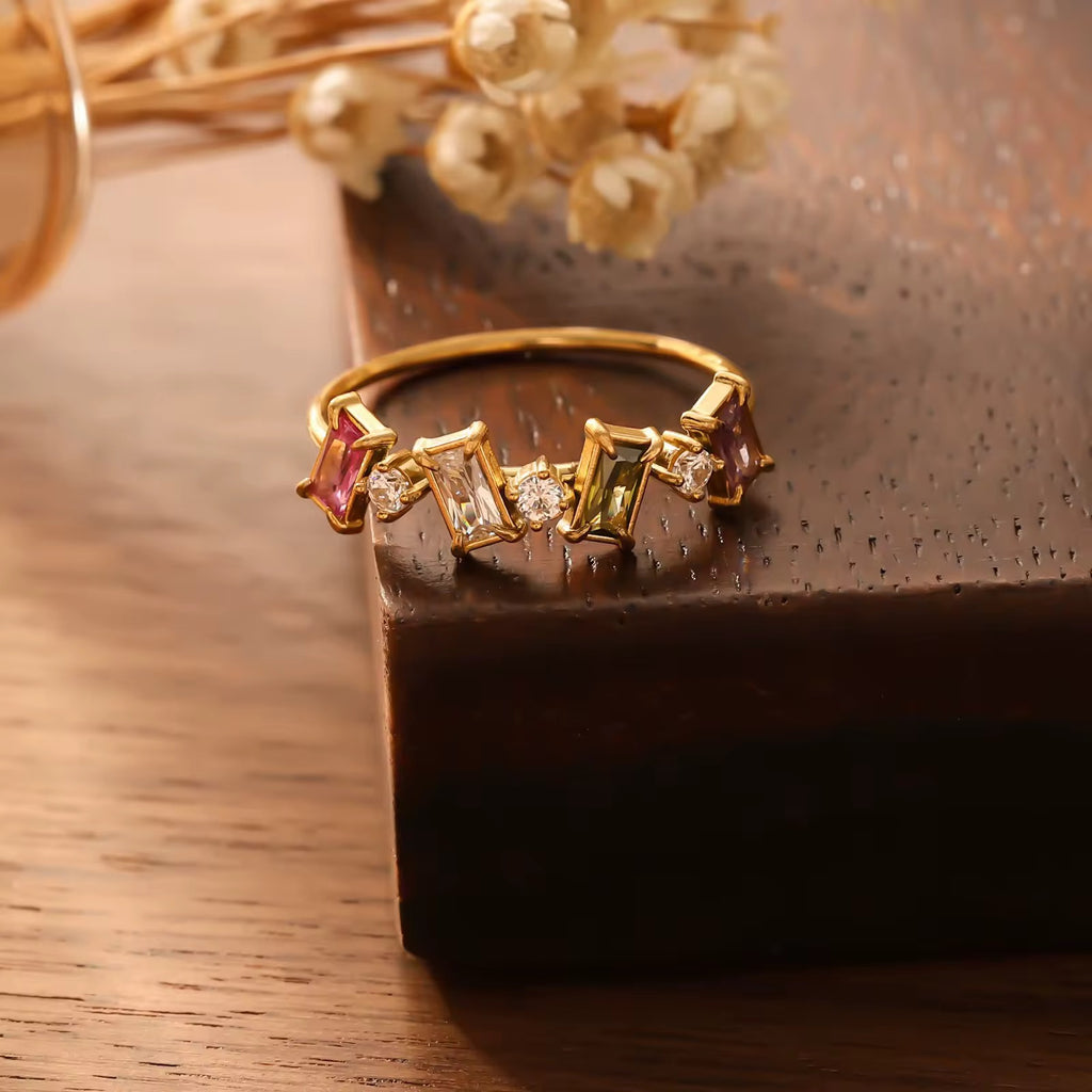 Sweat-proof everyday luxury gold stacking rings with modern asymmetric baguette settings.