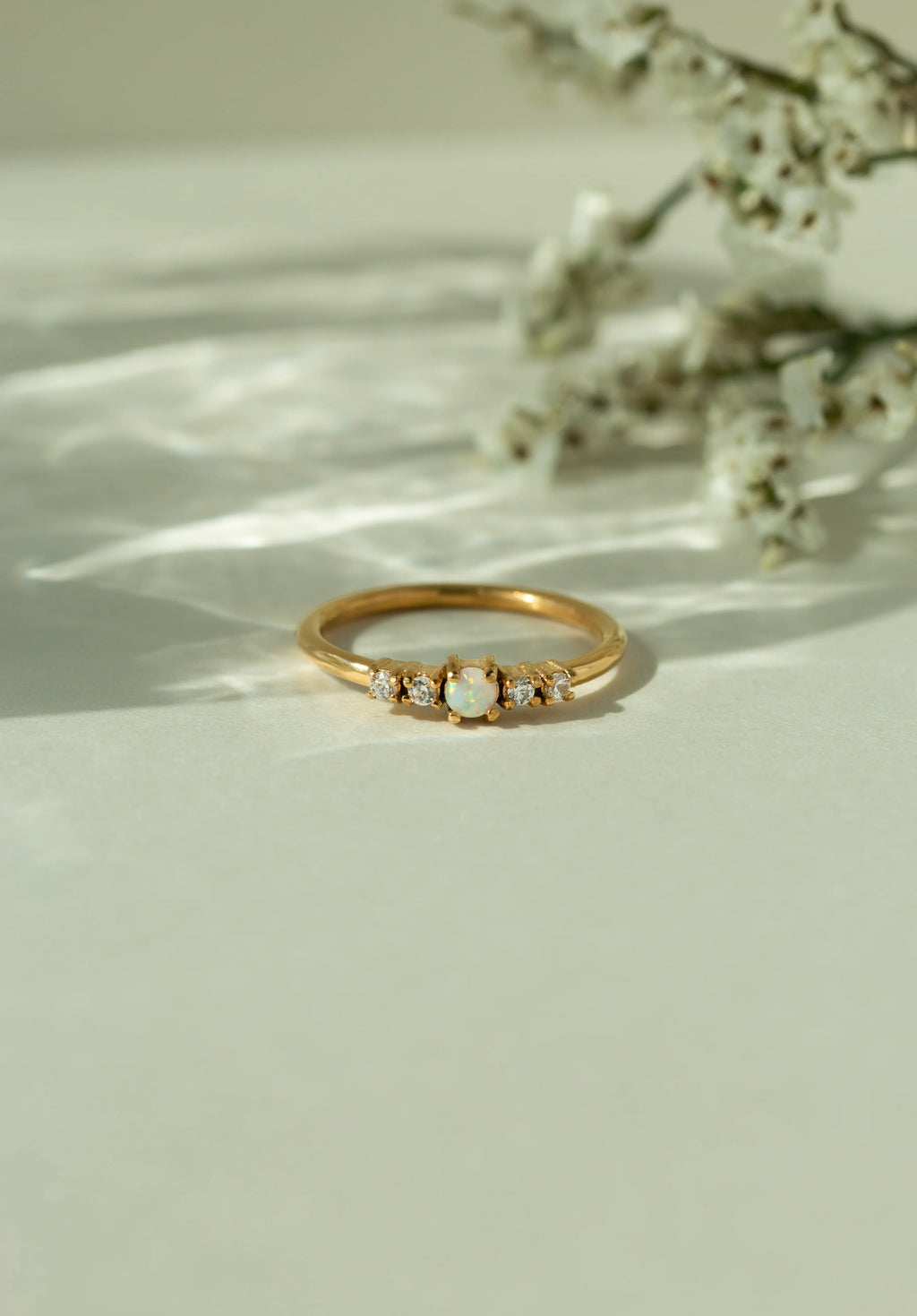 Dainty natural Australian opal engagement ring in a yellow gold band with accent diamonds. Elegant vintage inspired bridal jewelry and alternative gemstone promise ring for her.