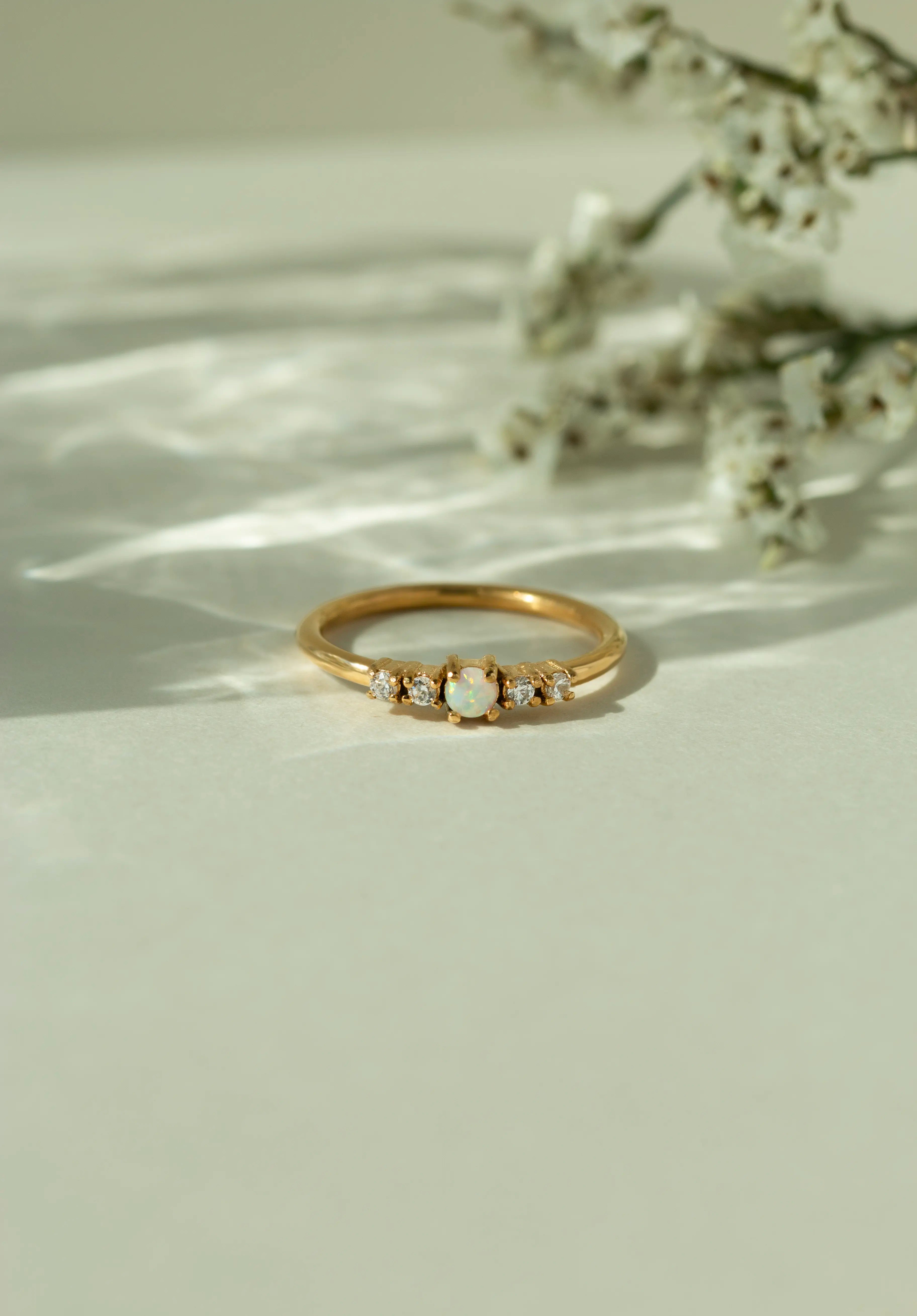  Dainty natural Australian opal engagement ring in a yellow gold band with accent diamonds. Elegant vintage inspired bridal jewelry and alternative gemstone promise ring for her.