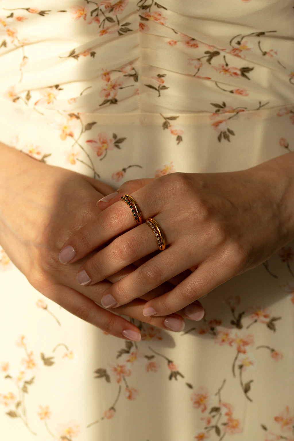 Green gemstone curved ring and clear crystal contoured band in yellow gold. Dainty May birthstone jewelry set, unique stackable matching promise rings gift idea for her.