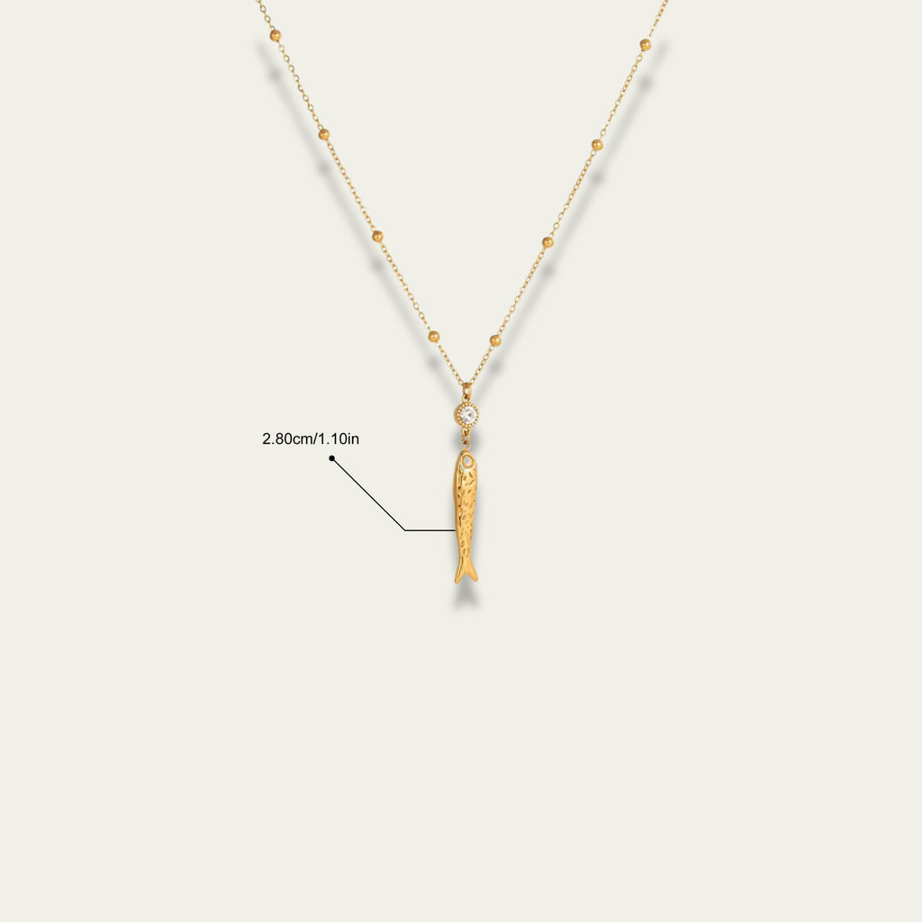 Detail shot of the 18k gold satellite chain and extender on Very Fishy Indeed.
