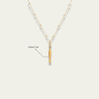 Detail shot of the 18k gold satellite chain and extender on Very Fishy Indeed.
