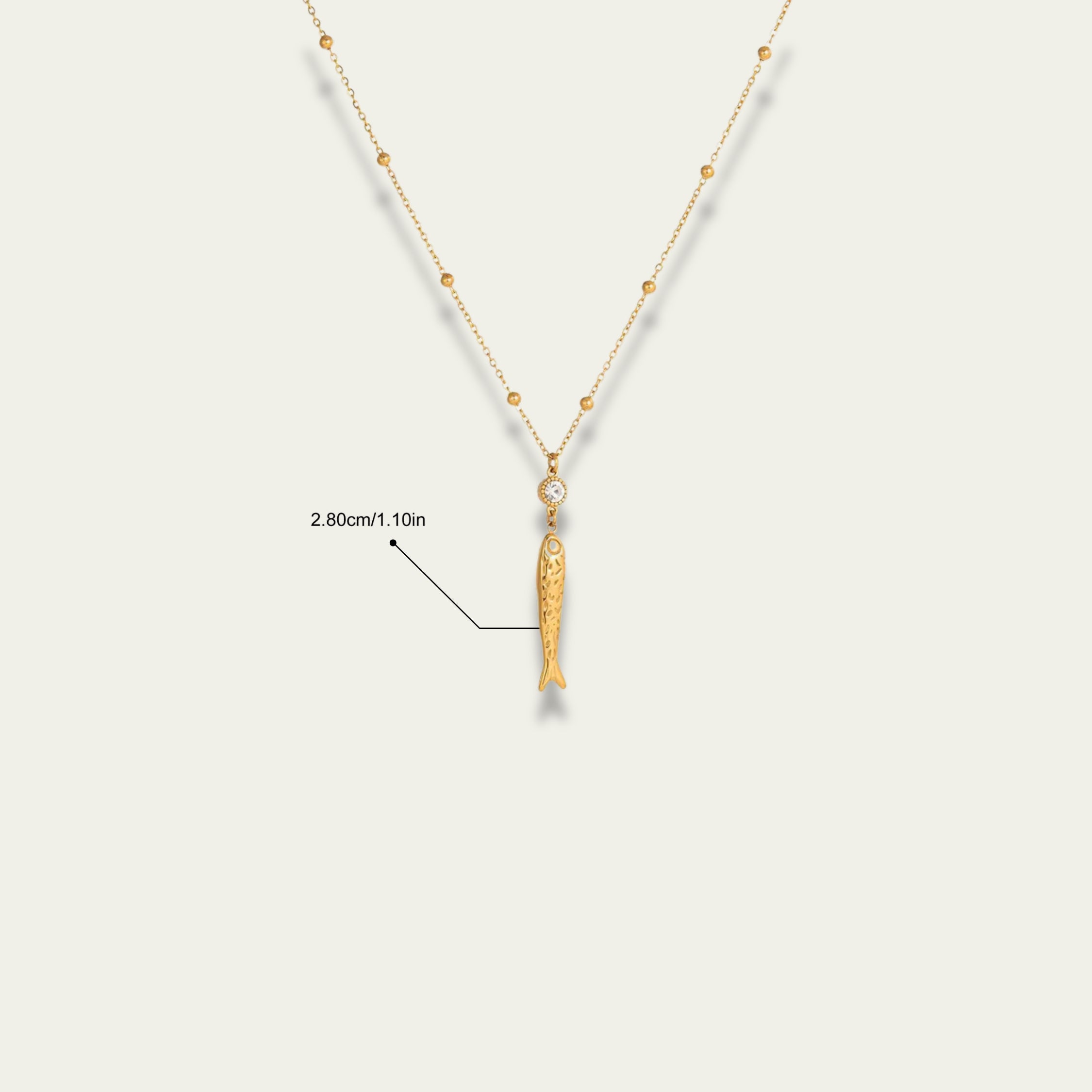 Detail shot of the 18k gold satellite chain and extender on Very Fishy Indeed.
