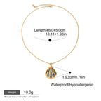 Gold necklace with a pendant on a white background, showing measurements and material details.