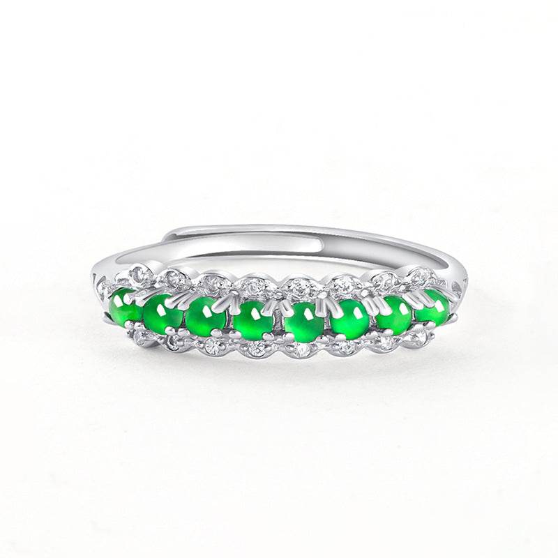 Minimalist green jade ring with zirconia accents in silver band design