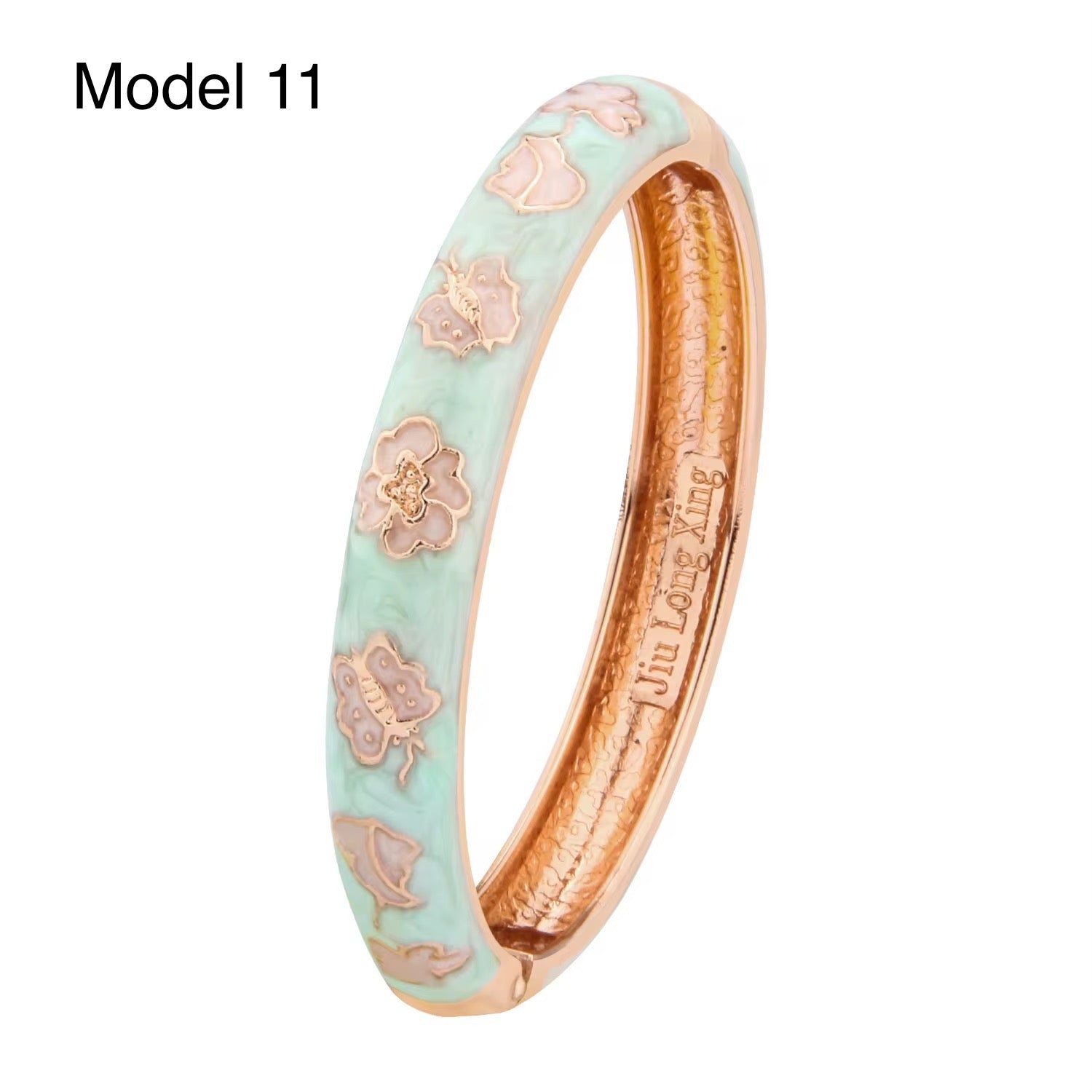 Gold enamel bangle featuring red rose patterns on turquoise background