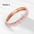 Elegant gold-plated enamel bangle with red magnolia flowers