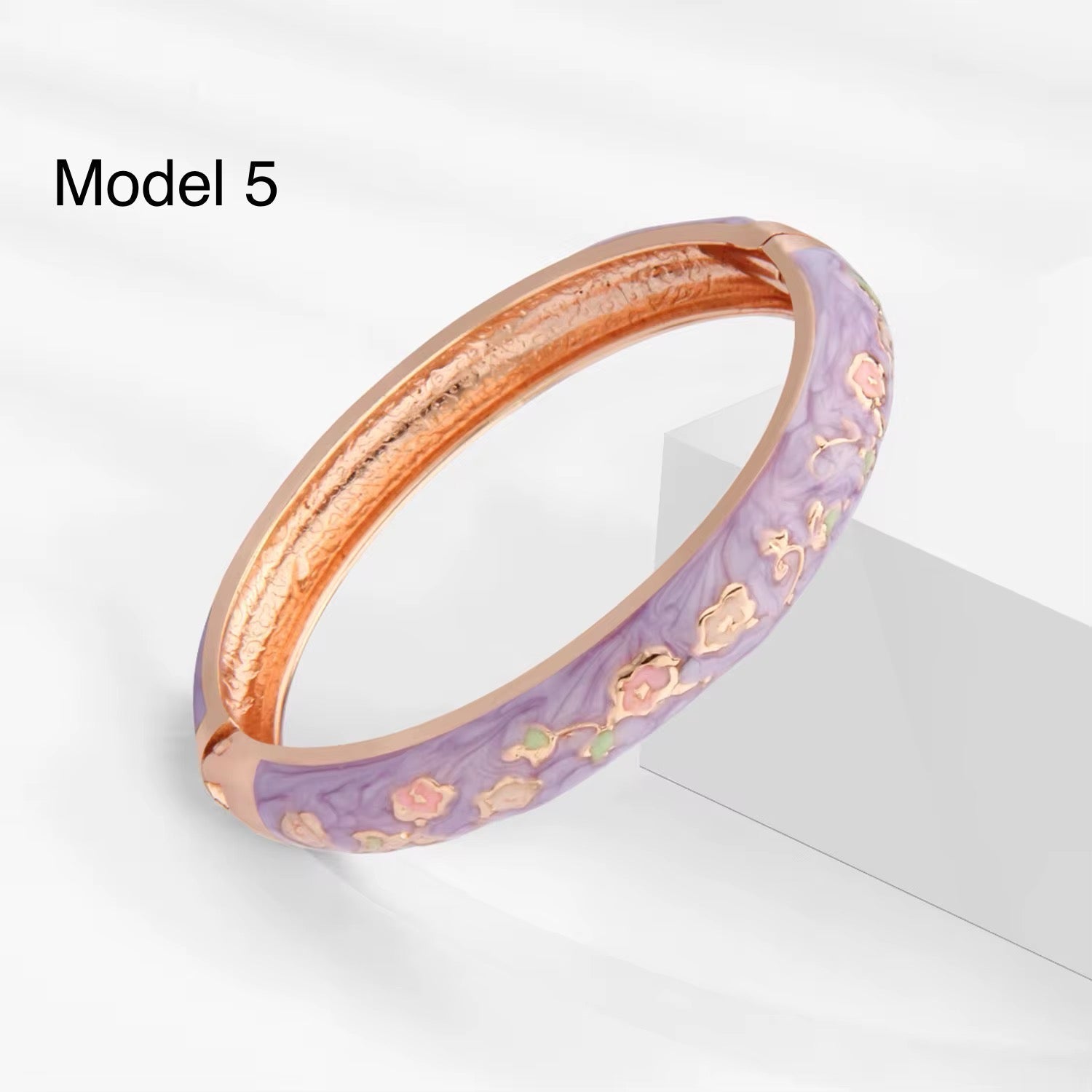Turquoise enamel bangle decorated with pastel cherry blossom motifs