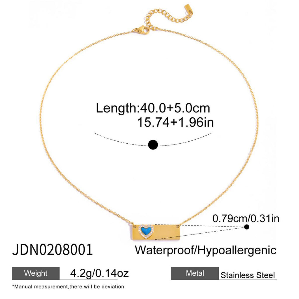 Gold necklace with blue heart pendant and measurement details on a white background