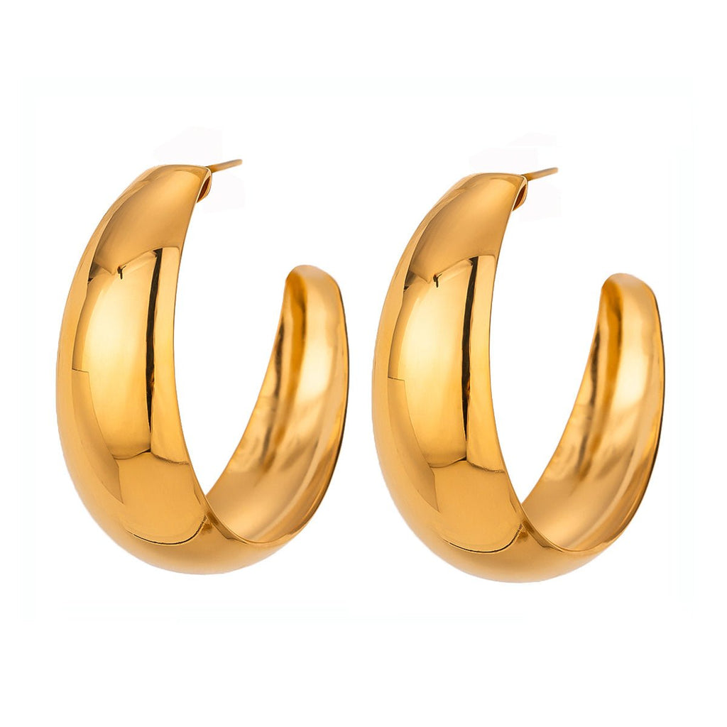 Gold hoop earrings on a white background