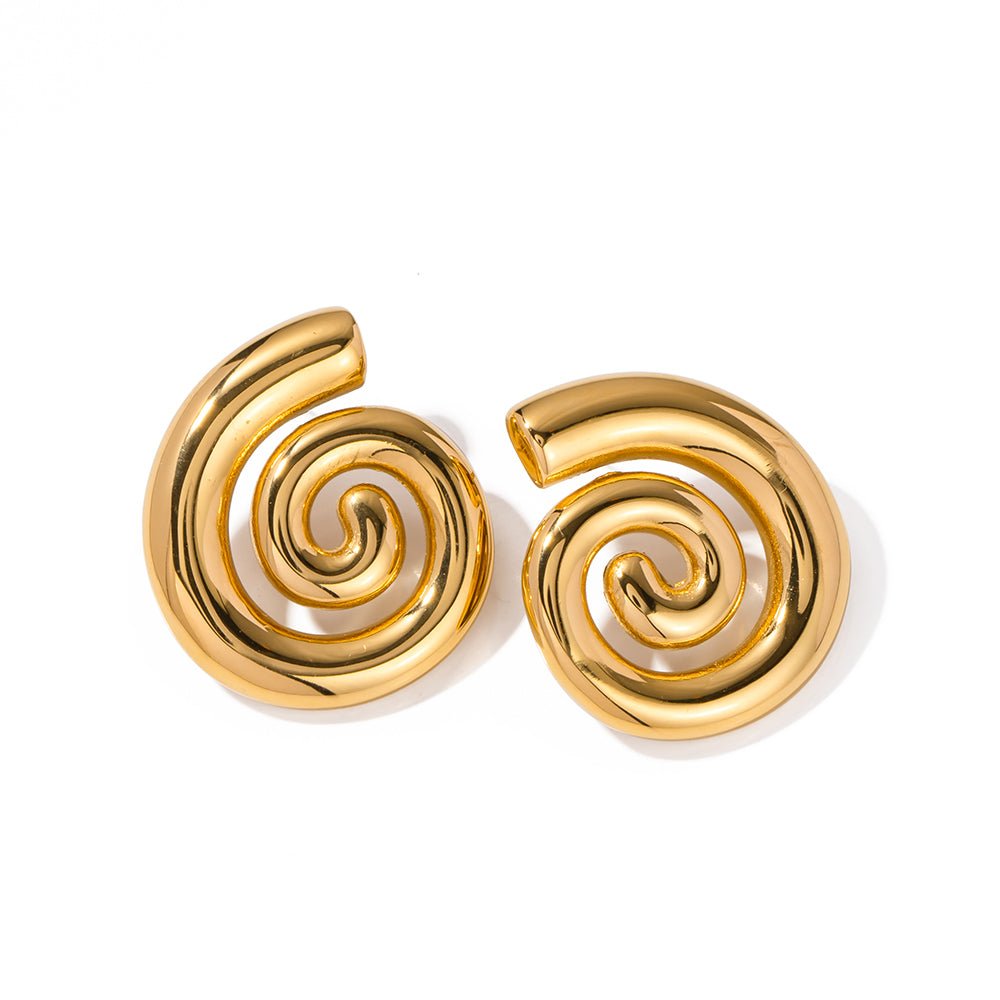 Gold spiral earrings on a white background