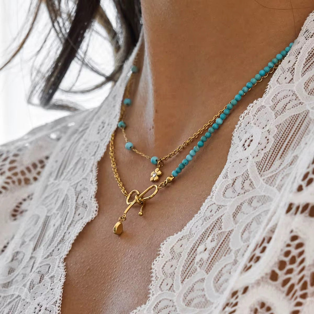 Gold Layered Necklace with Bow Pendant