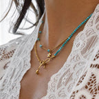 Gold Layered Necklace with Bow Pendant