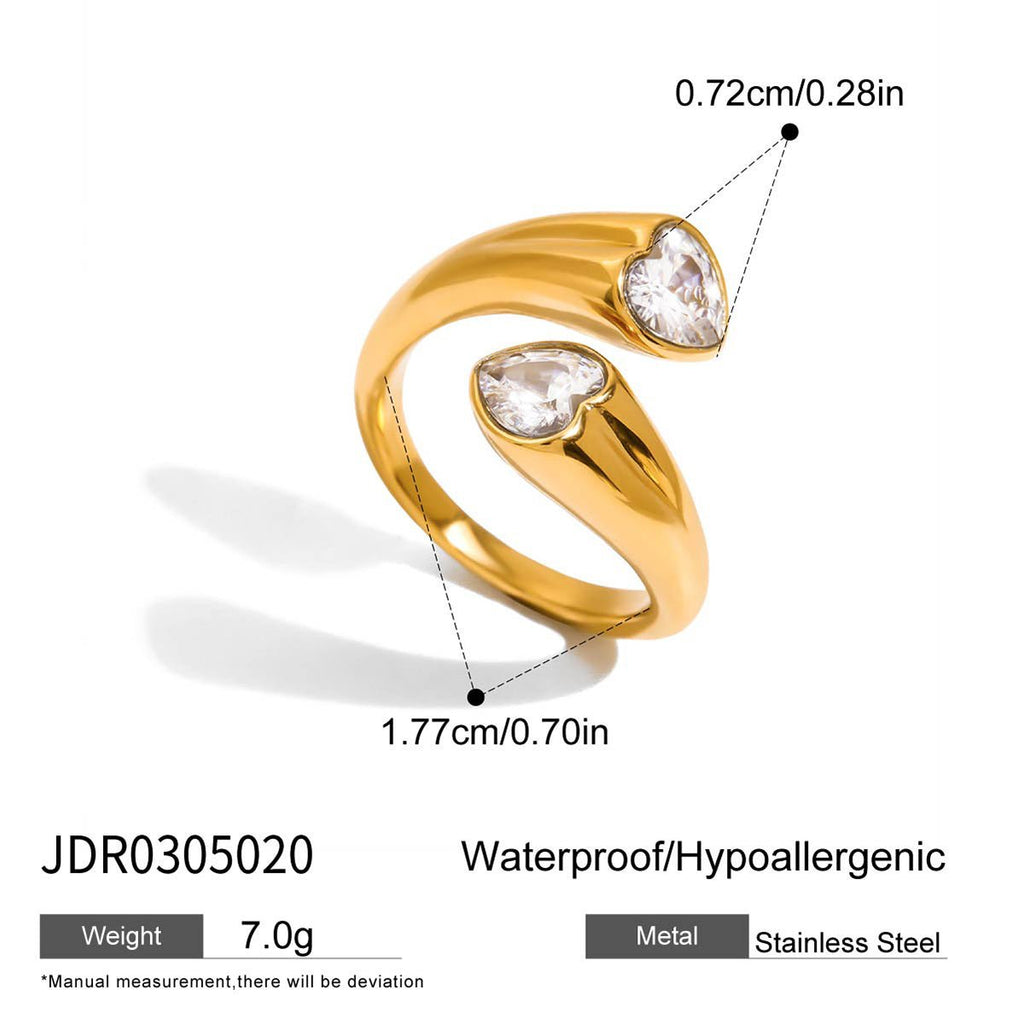 Gold ring with heart-shaped gemstones and measurements on a white background