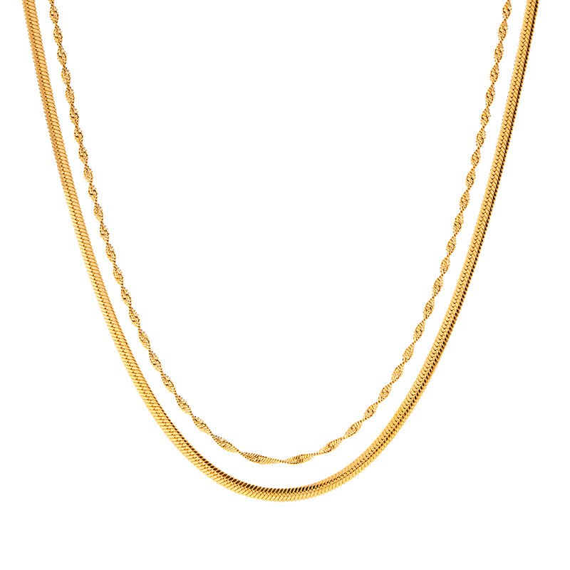 Two gold necklaces on a white background