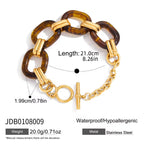 Bracelet with tortoiseshell and gold links on a white background