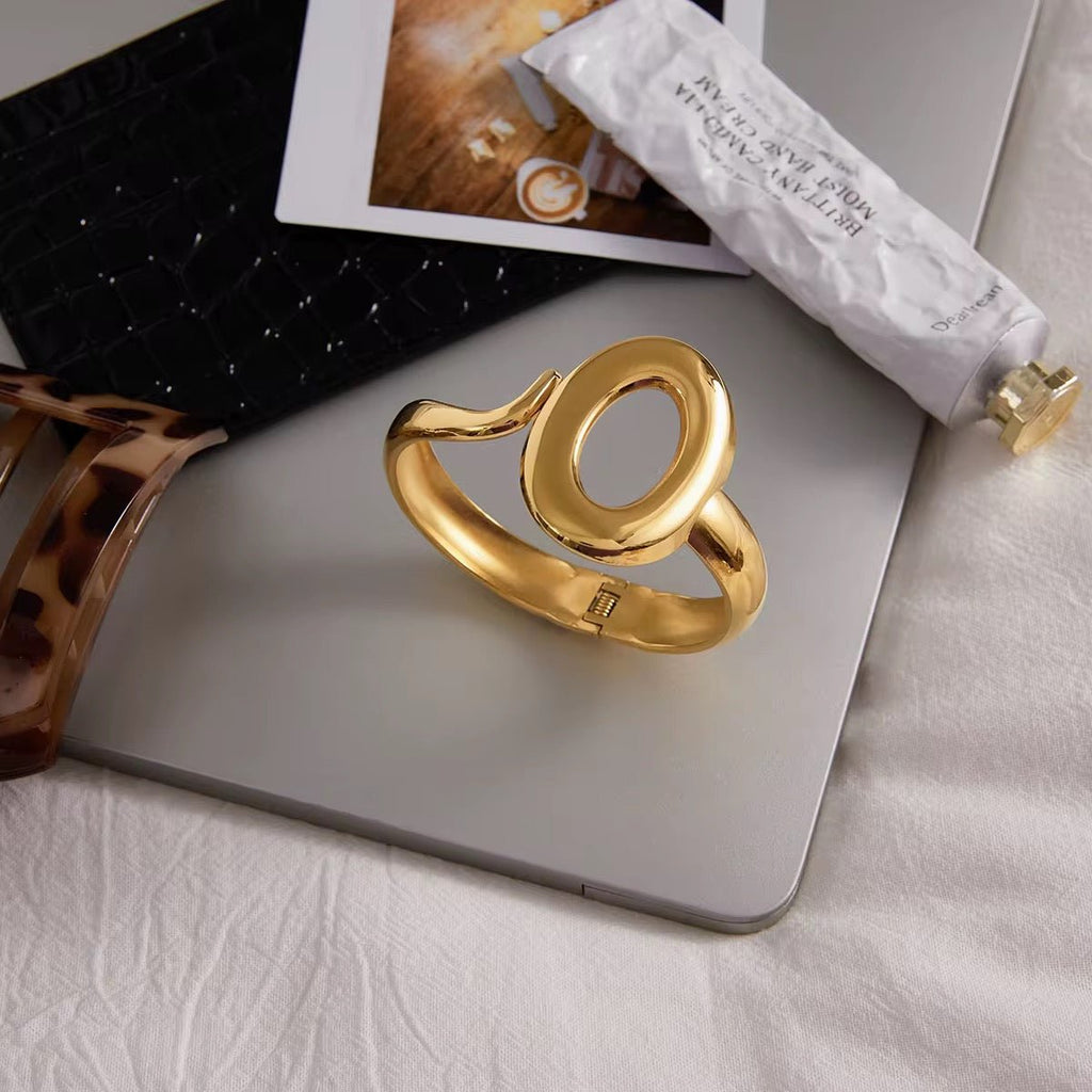 Gold ring on a laptop with a blurred background