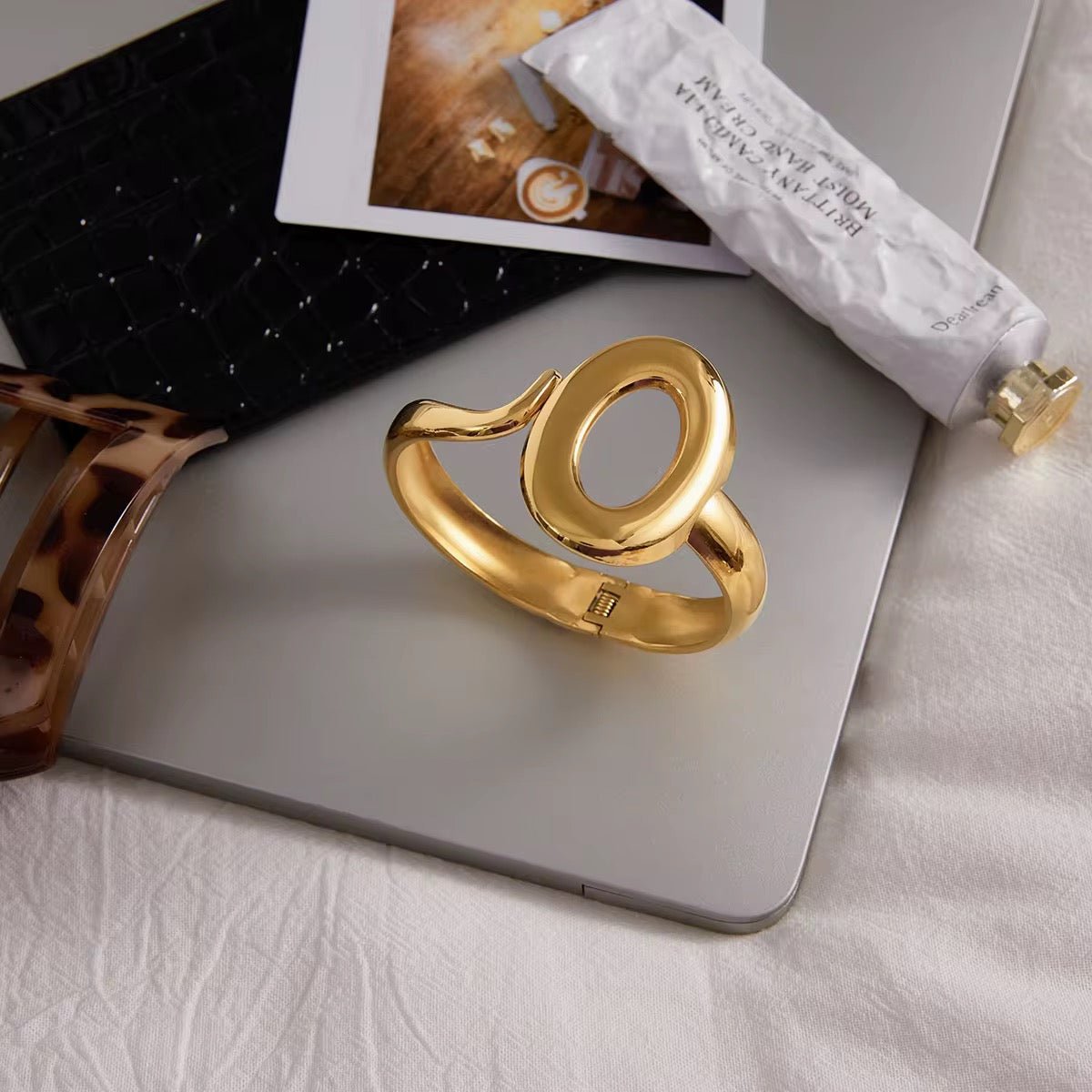 Gold ring on a laptop with a blurred background