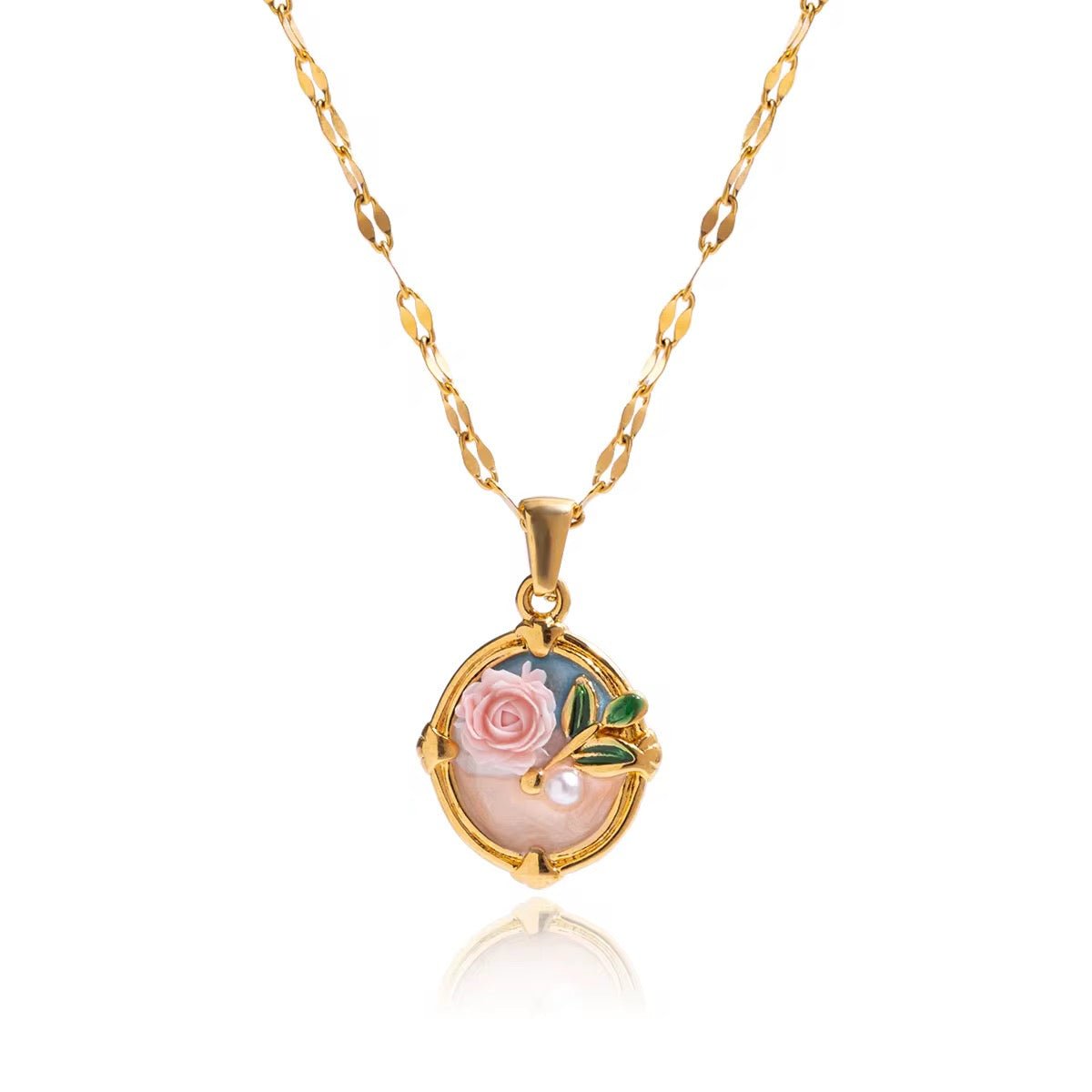 Gold necklace with a pendant featuring a rose and pearl on a white background