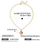 Gold necklace with pendant, measurements, and material details on a white background