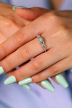 Elegant opal ring with infinity-style band