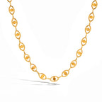 Gold chain necklace on a white background