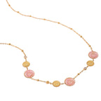 Necklace with pink and gold floral pendants on a white background