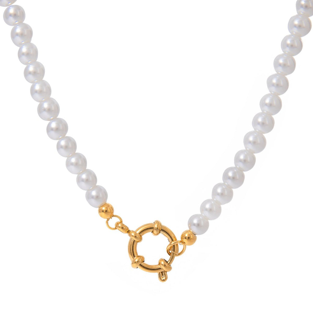 Pearl necklace with a gold clasp on a white background